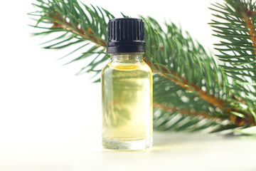 Essence of pine on table in beautiful glass jar