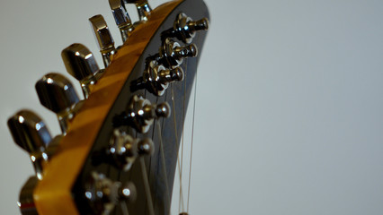 guitar headstock with tuning pegs . color background