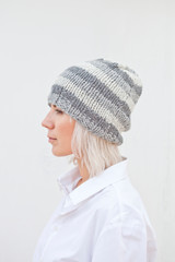 Pretty young woman in warm gray beanie