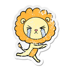 distressed sticker of a cartoon crying lion