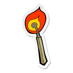 sticker of a cartoon burning match