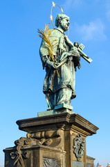 Fototapeta na wymiar Sculptural compositions of Charles Bridge, Prague, Czech Republic. Saint Jan of Nepomuk (1683)
