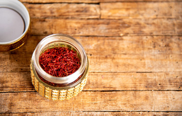 Obraz na płótnie Canvas Saffron spice tea crop in a traditional box