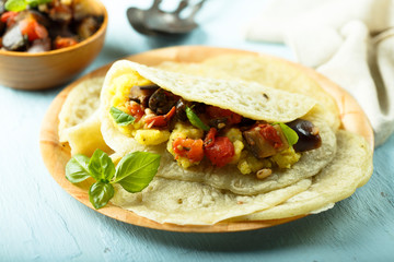 Homemade flatbread stuffed with potato, tomato and eggplant
