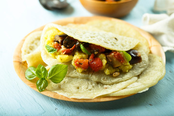 Homemade flatbread stuffed with potato, tomato and eggplant