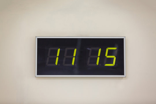 Black digital clock on a white background showing time 11.15 minutes
