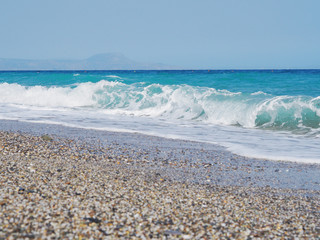 Sea splashes and blue storm sea background.Sunny day.
