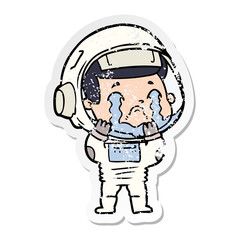 distressed sticker of a cartoon crying astronaut