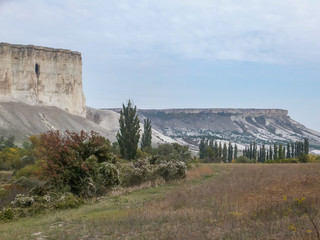 Calm landscape of white slopes Mount Ak-Kaya, the famous sight of the Crimea, on a cloudy autumn...