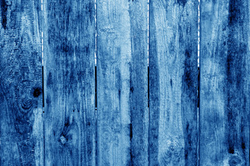 Old grunge wooden fence pattern in navy blue tone.