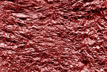 Metal foil texture in red color.