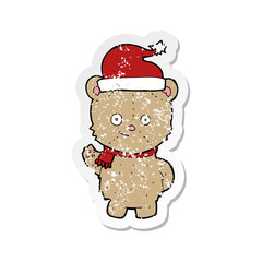 retro distressed sticker of a cartoon christmas teddy bear