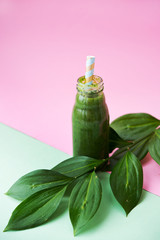 Fresh green smoothie with spinach leaves. A bottle of spring drink. Detox.