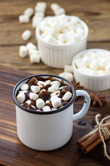 Fototapeta na wymiar Hot chocolate with marshmallows in a white metal vintage mug