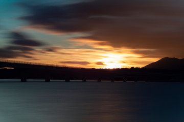 Nice sunset after a viaduct crossing over a lake
