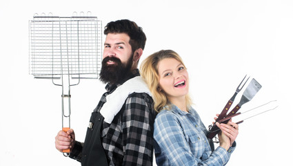 Ideal for your homemade barbecue. Bearded man and cute girl holding cooking grate. Happy couple having grill grate for grilling. Hipster and woman with grate tools. BBQ grate for barbecue party