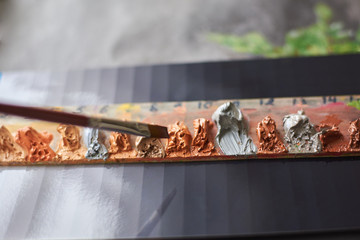 The palette of oil paints for painting
