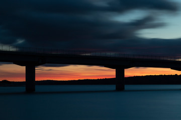 Nice sunset after a viaduct crossing over a lake