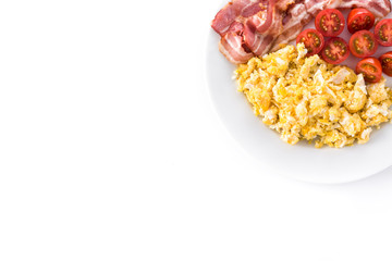 Breakfast with scrambled eggs, bacon and tomatoes isolated on white background. Top view. Copyspace