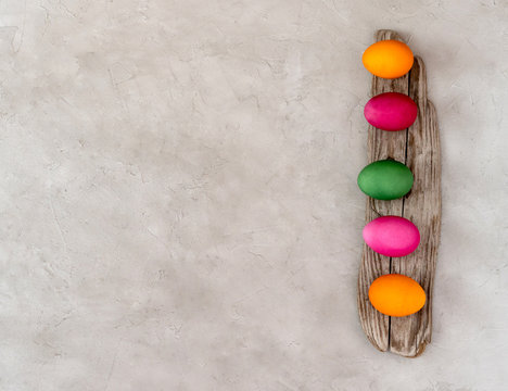 Easter eggs on a wooden board.