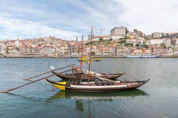 Fototapeta na wymiar Porto, Portugal old town cityscape on the Douro River with traditional Rabelo boats
