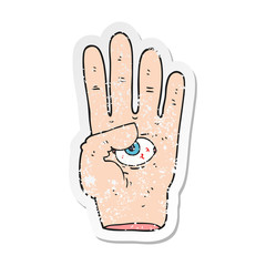retro distressed sticker of a cartoon spooky hand with eyeball