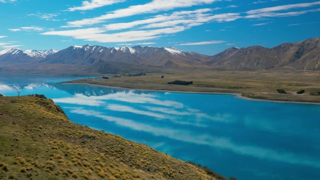 Lake Tekapo with reflection of sky and mountains, New Zealand