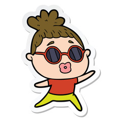 sticker of a cartoon dancing woman wearing sunglasses