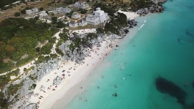 View of Tulum ruins in the Yucatan in Mexico - a popular destination for tourists. Overlooking the Caribbean Sea in the Riviera Maya. Aerial View.