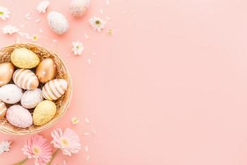 Easter Flat Lay of Eggs with flowers on pink