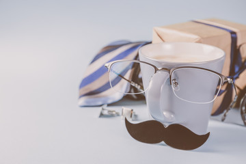 Fathers day concept - present, coffee, tie, mustache copy space