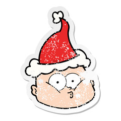 distressed sticker cartoon of a curious bald man wearing santa hat