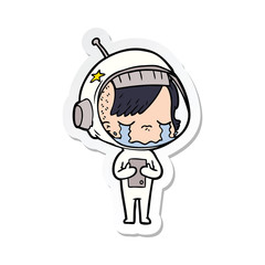 Obraz premium sticker of a cartoon crying astronaut girl