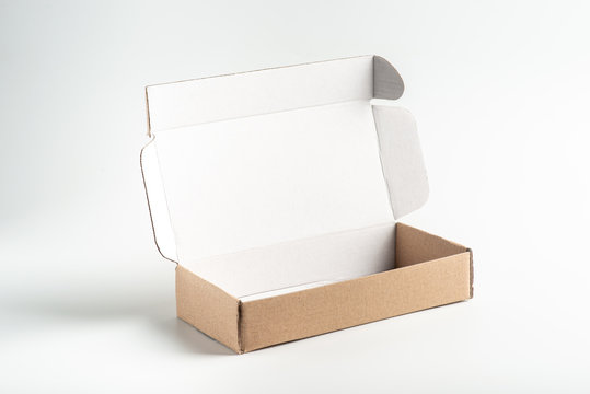 Kraft Cardboard Box On A White Background, Moke Up