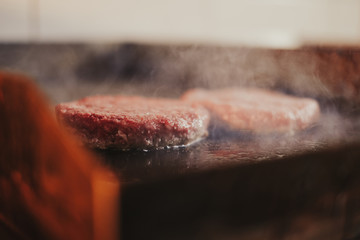 Burgers frying on the grill