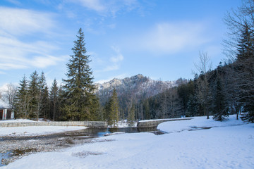 View on top of the mountains in the Zakopane area in Poland covered with fresh snow on the day with blue sky