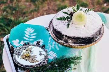 Homemade cake, top view. The cake is sprinkled with powdered sugar. Located on a white background.