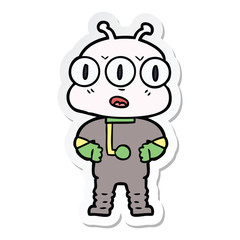 sticker of a cartoon three eyed alien