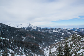 Mountain peaks in Zakopane and in Poland covered with fresh snow in the daytime with blue sky