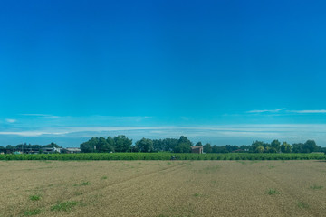 Italy,La Spezia to Kasltelruth train, a large green field with trees in the background