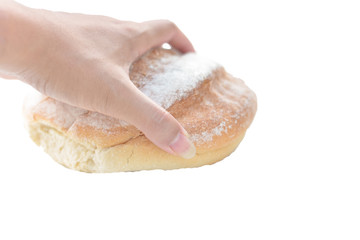 Bread in hand on white background.