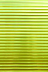 The background and texture of the metal blinds are light green in color.