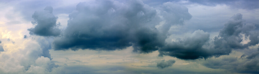 Gray rainy sky with big clouds. Nature background.