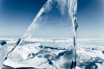 Obraz na płótnie Canvas Blocks of ice gleaming in the sun. Arctic winter background.