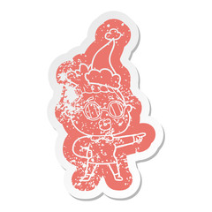 cartoon distressed sticker of a pointing woman wearing spectacles wearing santa hat