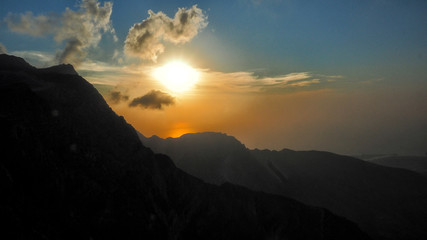 Fantastic sunset in the mountains. Jebel Rahabah. Viewpoint near Jebel Jais. Al Hajar Mountains. Ras Al Khaimah. United Arab Emirates