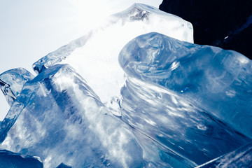 Blocks of ice gleaming in the sun. Arctic winter background.