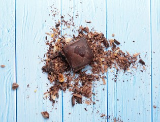 cocoa and milky chocolates on the blue floor