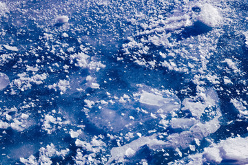Blue ice texture. Abstract arctic winter background.
