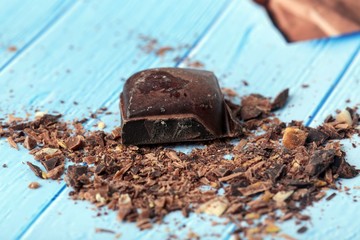 cocoa and milky chocolates on the blue floor
